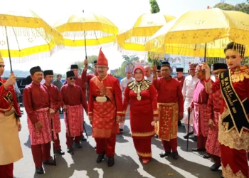 Pj. Wali Kota Kotamobagu, Asripan Nani, Dijemput Prosesi Adat Tempati Rumah Dinas