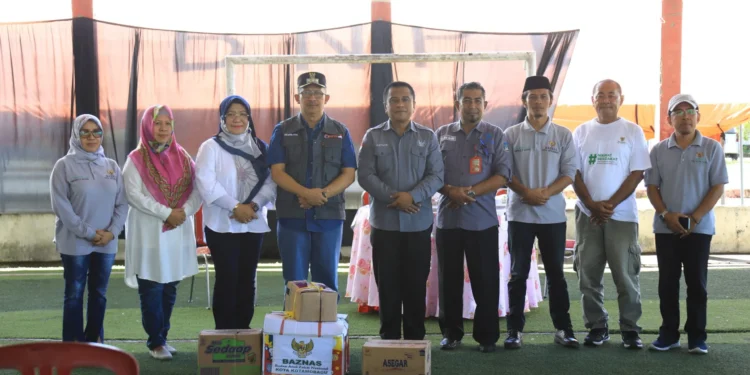 Pj Wali Kota dan Rombongan SKPD Kotamobagu Serahkan Bantuan Logistik Bagi Warga Bolsel yang Terdampak Bencana