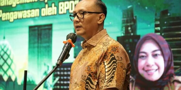 Sekda Kotamobagu Bekali Sangadi dan BPD Tingkatkan Tata Kelola Keuangan Desa Berbasis Digital